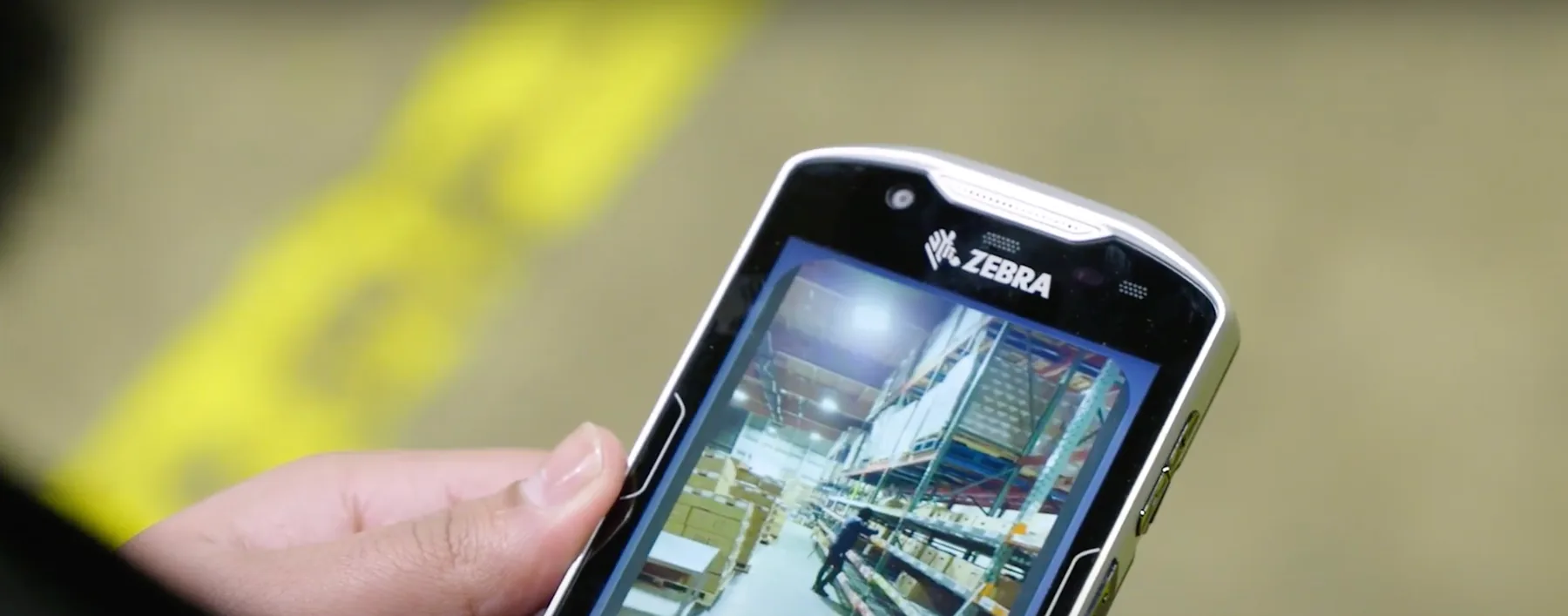 A ColdTrack team member using how.fm training on a Zebra handheld device